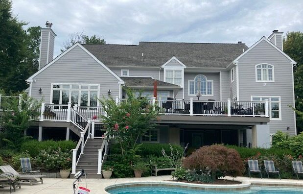 Replaced stucco siding with Hardie 8-1/4'' Cedarmill Fibercement, Pearl Gray Siding; Newtown Square, PA, Chester County, PA; Installed August 2022