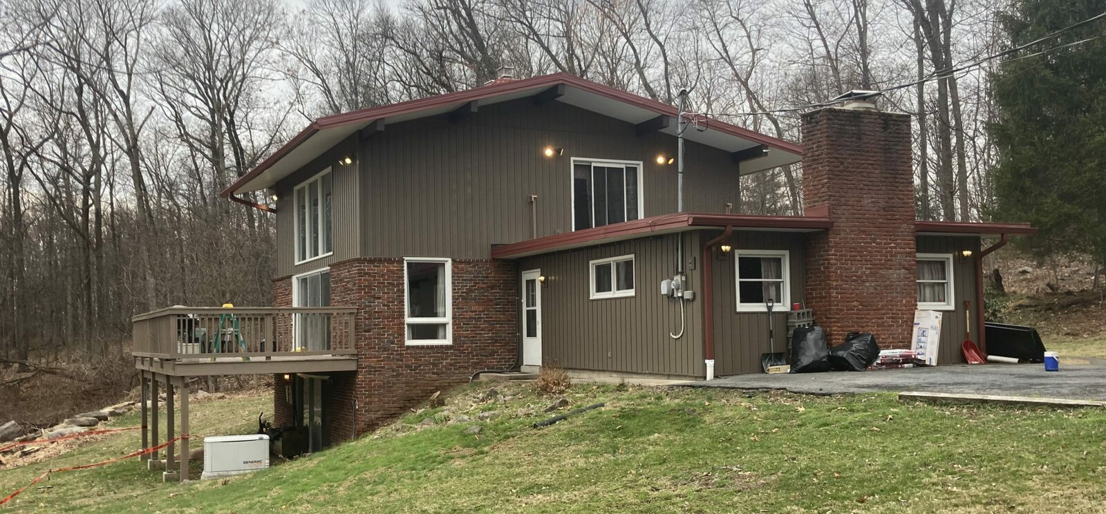 ABS Metal Roof, Color: Colonial Red, Red Seamless Gutters White Vinyl Soffit, Red Fascia, EPDM Rubber Roof on lower section, Mohnton, PA, Berks Co. PA, Installed April 2022