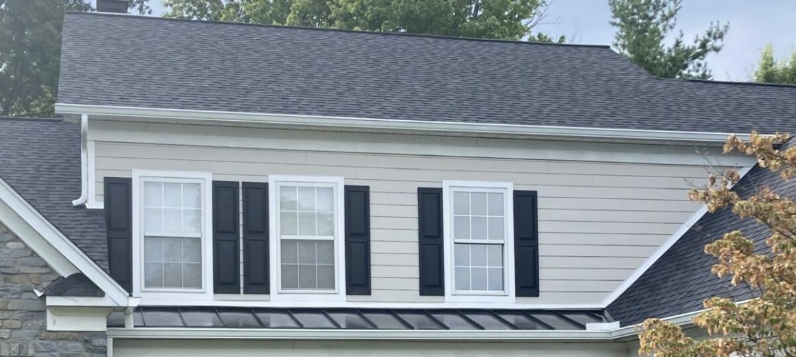 Black shingles; Black standing seam metal porch roofs